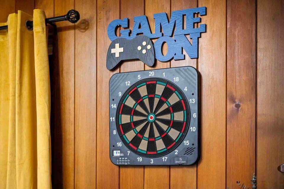 Play a game of darts in the game room.