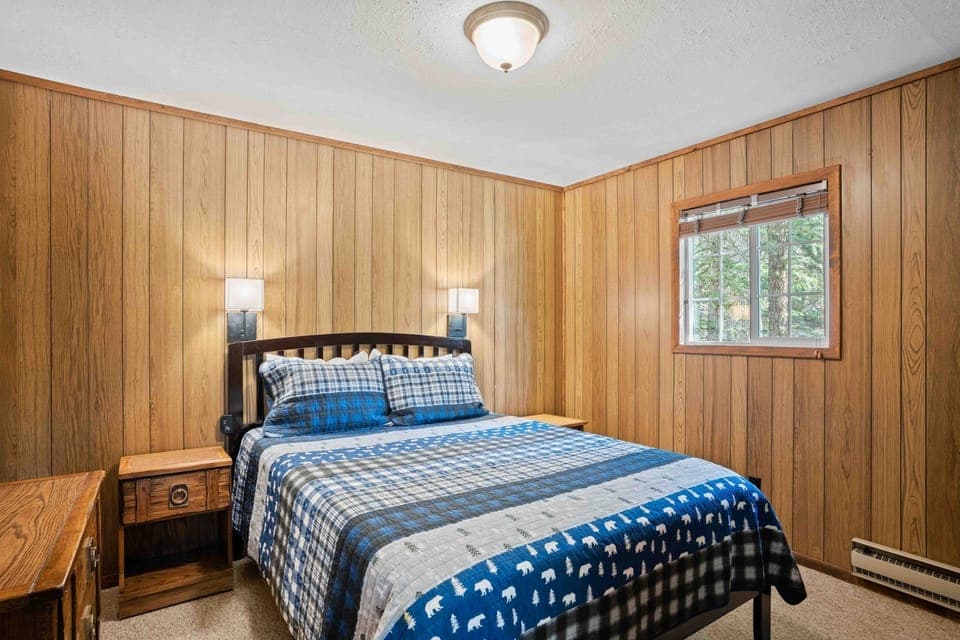 Unwind in cozy plaid bedding after a day outdoors.