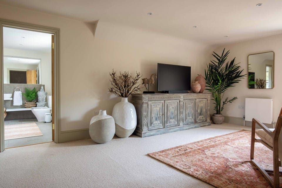 The generous bedroom leads through to the ensuite bathroom 