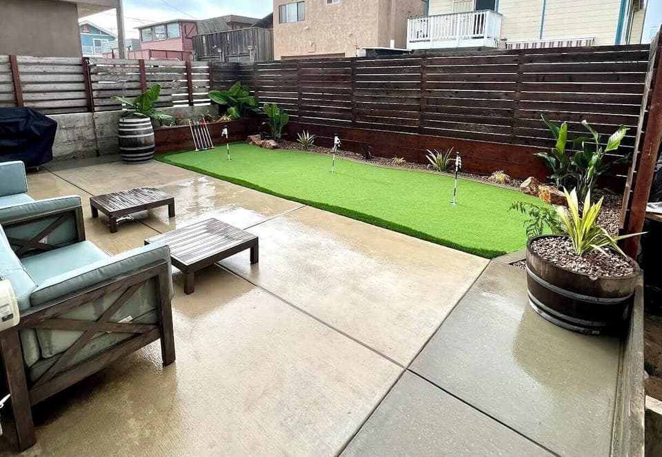 Backyard mini golf, propane bbq and outdoor shower to wash the sand away.