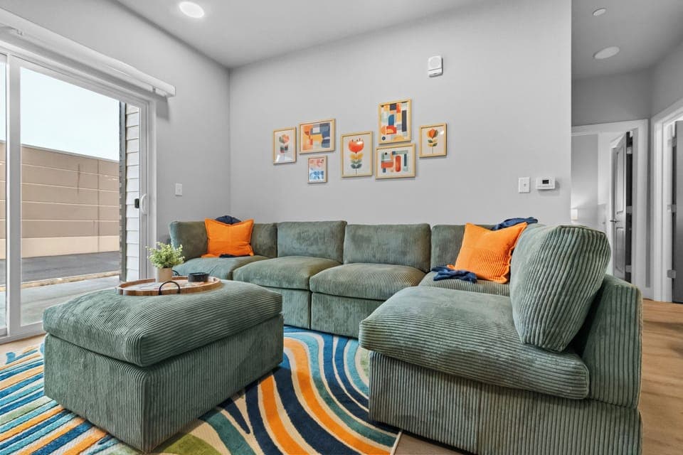 Step into the inviting open-concept living space, flooded with natural light. The contemporary decor and plush sectional is perfect for relaxing after a day of exploring. Need extra space for sleeping this couch is perfect and can easily sleep 2.