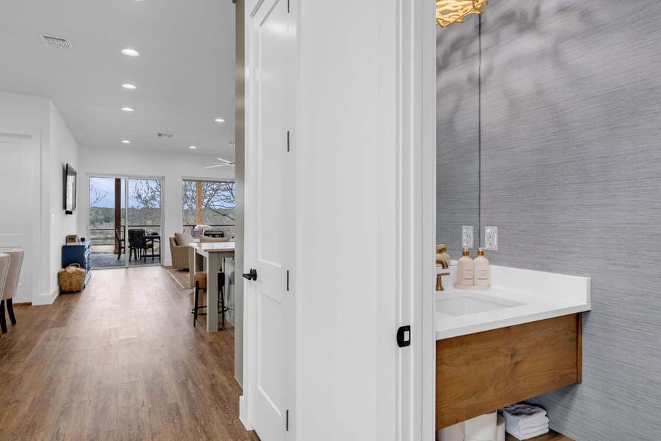 Half bathroom found in the hallway near the kitchen