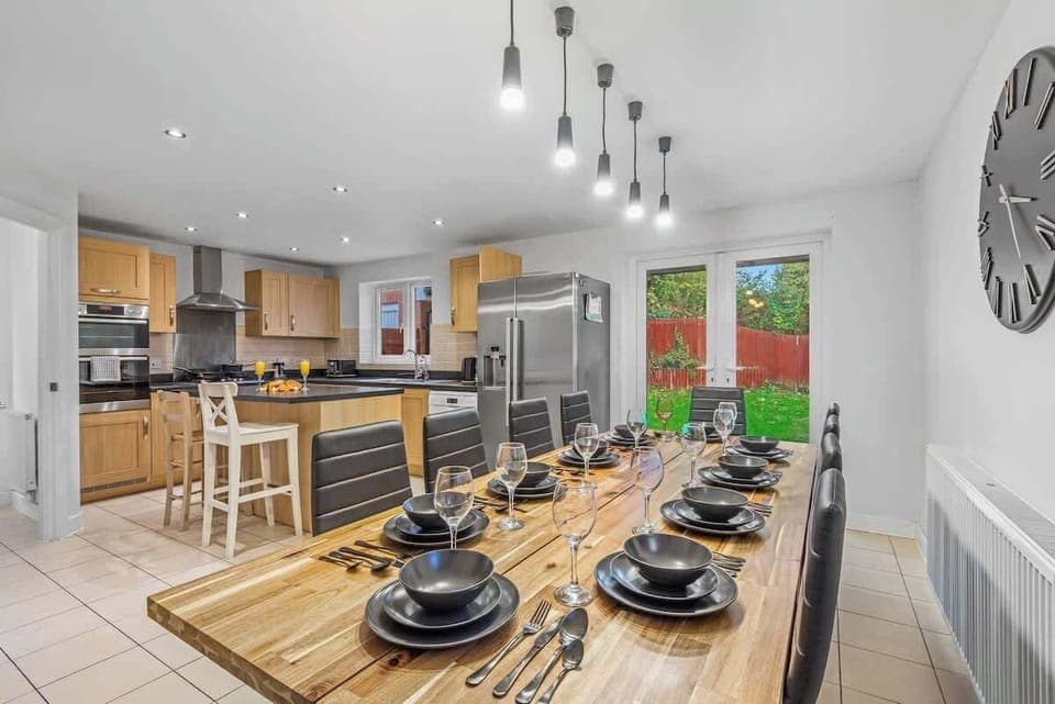 The dining area provides a warm and inviting space to enjoy meals together. Its thoughtful design creates the perfect setting for both casual gatherings and intimate dinners.