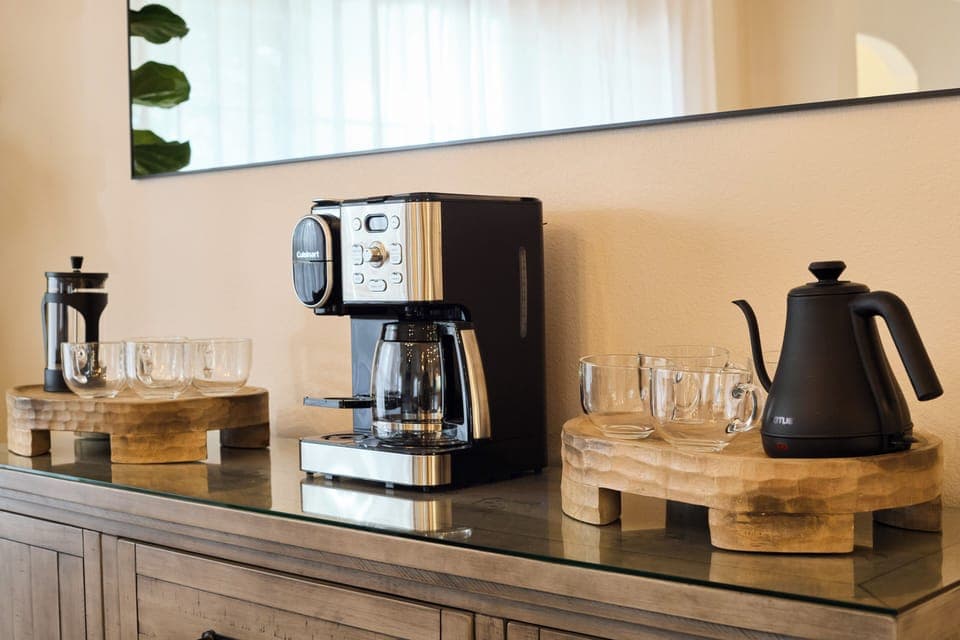 Coffee bar with a French Press, pour-over coffee setup, and 2-in-1 coffee maker