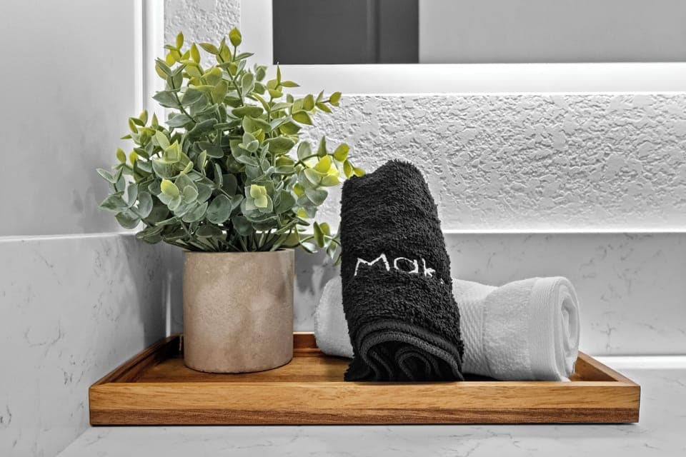 Elegantly appointed bathroom, ensuring a spa-like experience during your stay. Bathrooms are stocked with plush towels, microfiber cloths, hand soap, shampoo, conditioner, body wash, and essential toiletries.