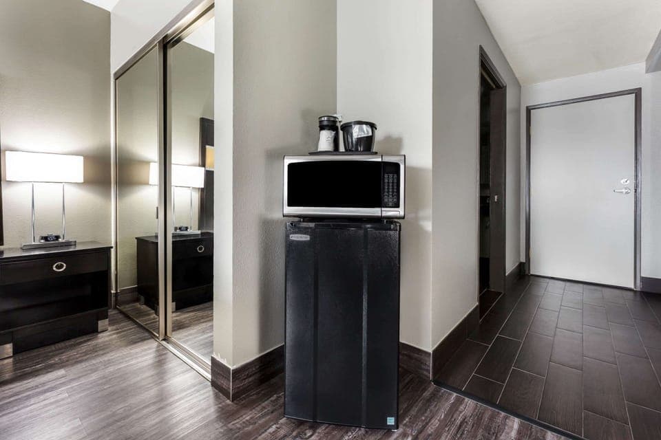 Premium bedding, desk, laptop workspace, blackout drapes