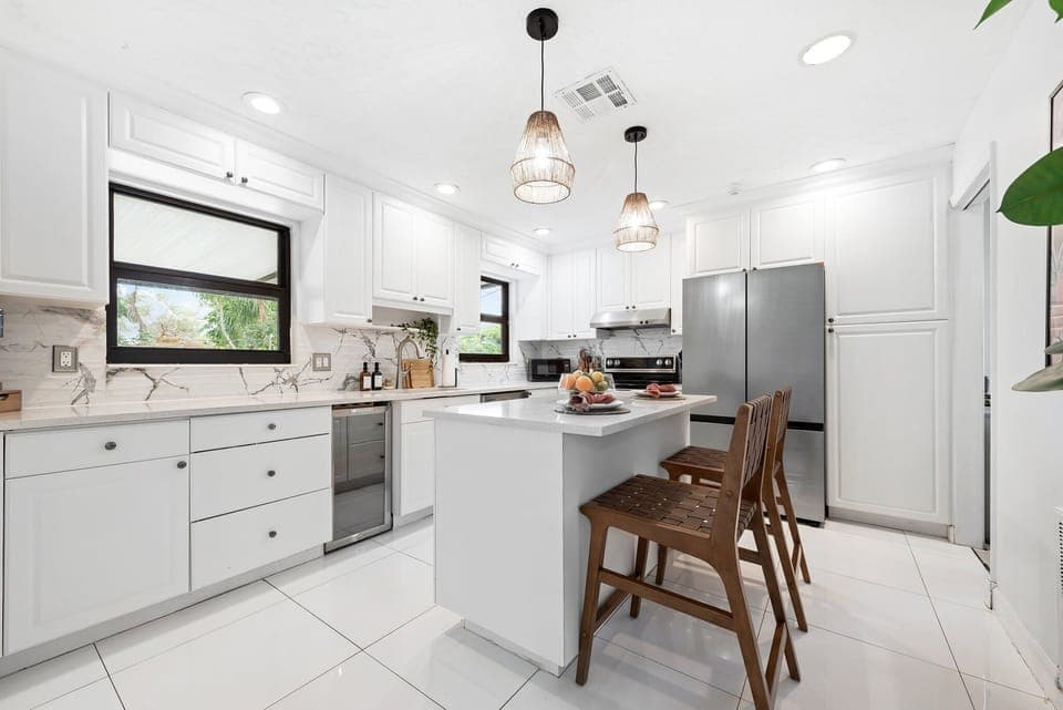 Compact kitchen with kitchen island with bar seating for 2