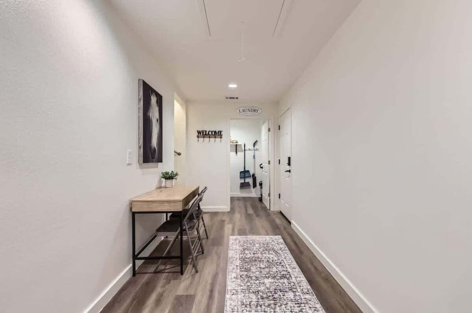 Spacious hallway with a functional desk area, perfect for catching up on work or planning your day.