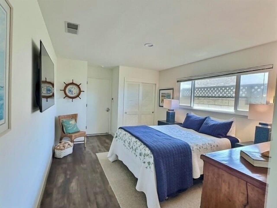 Bedroom 3 - The versatile third bedroom acts as a pass-through to the garage and fourth bedroom. Cozy and practical, it’s ideal for guests or flexible living while maintaining a warm, inviting feel.