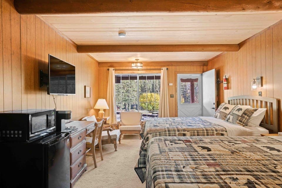 Settle into cozy beds with sunlight and mountain-town vibes.