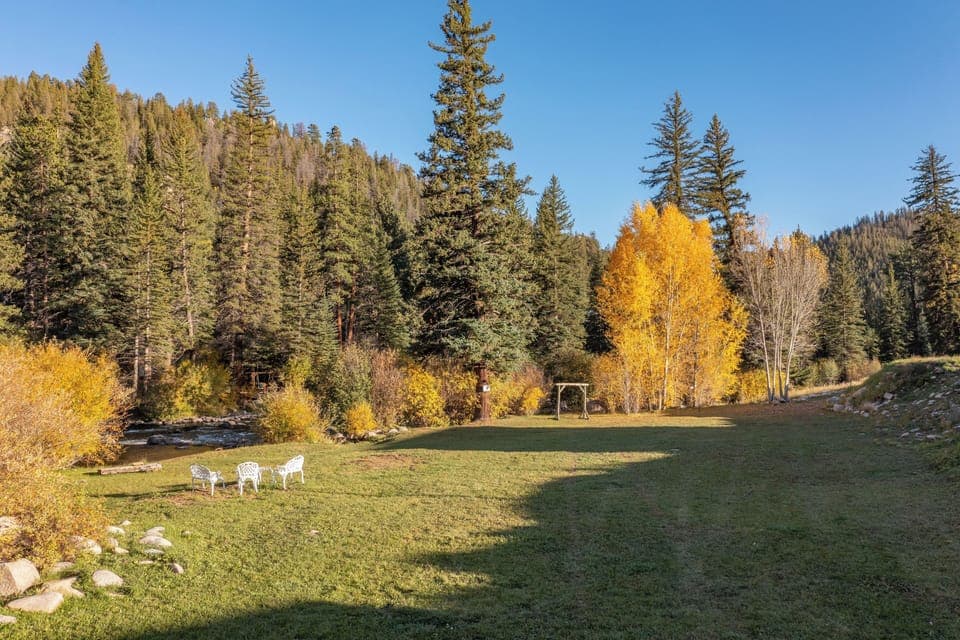Unwind on the riverside lawn with mountain air all around.