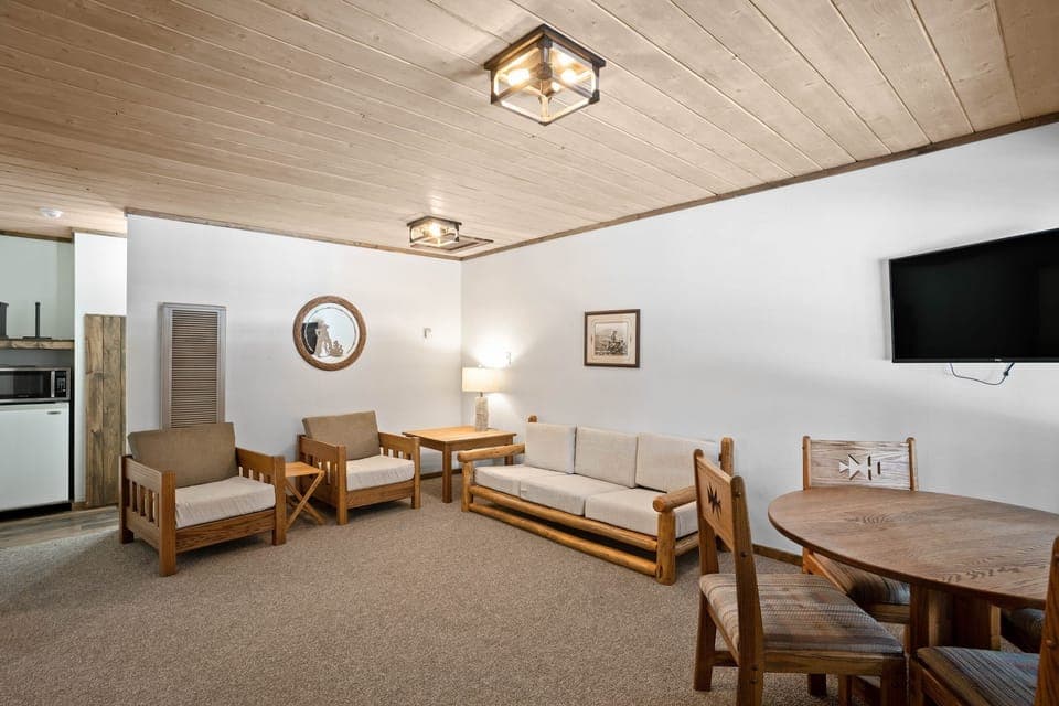 Settle in with seating, dining table, and easy kitchenette access.
