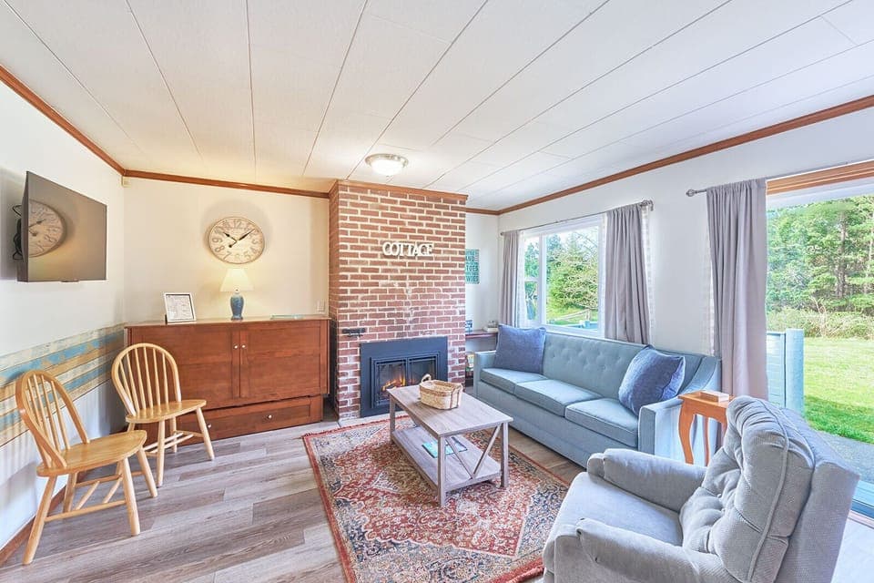 Cozy living room with a space-saving Murphy bed — comfort meets function. 🛋️🛏️