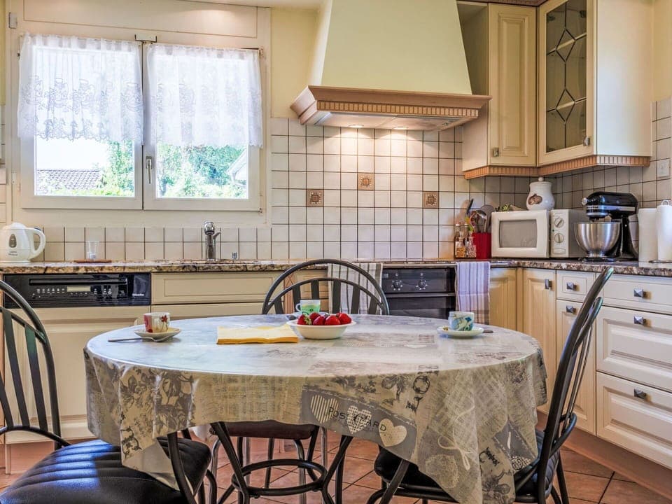 Furniture, Kitchen, Interior Design, Countertop, Kitchen Appliance, Flooring, Cabinetry, Wood, Room, Floor