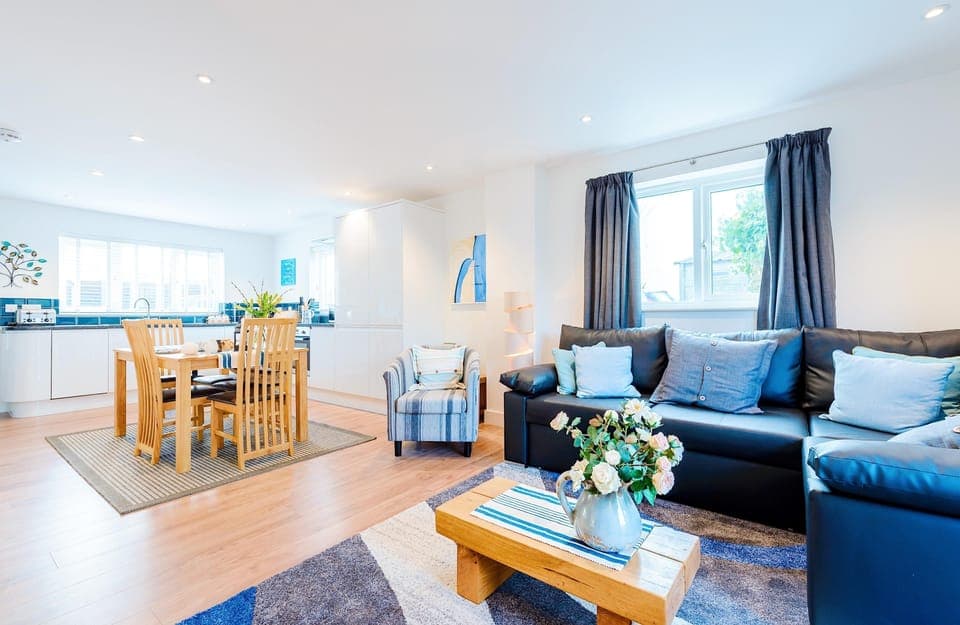 Fistral Palms 2, Newquay: The open-plan living space features sitting, dining and kitchen areas
