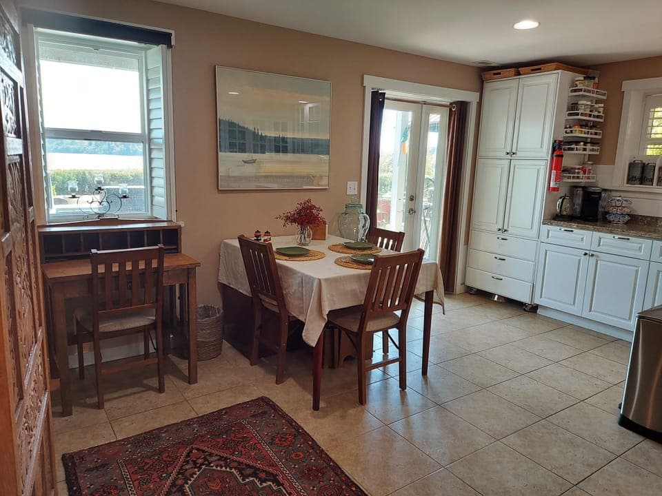 Entry to apartment showing pantry and kitchen table
