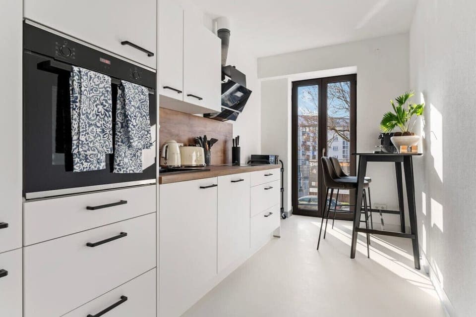 Kitchen with a small seating area.