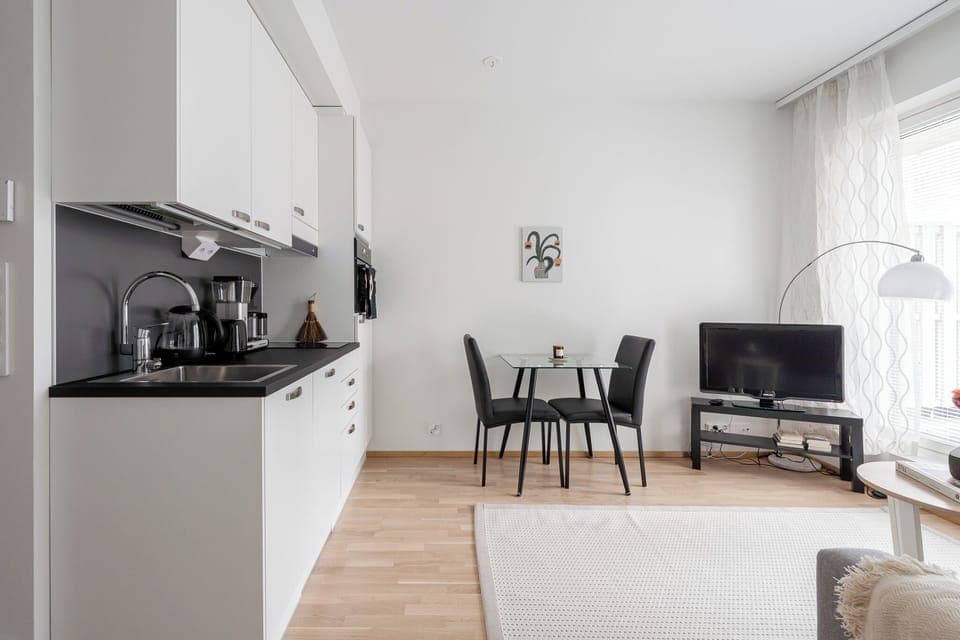 Basic Apartment, Courtyard View | Living area | 50-inch TV with cable channels
