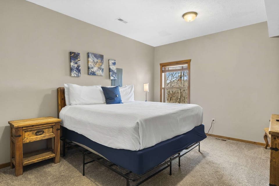 A plush king bed, smart TV, & ensuite await in the final bedroom retreat