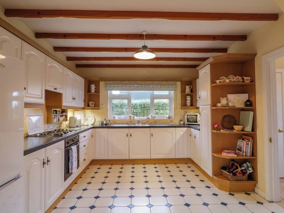 Fridge, electric kettle, toaster, cookware/dishes/utensils