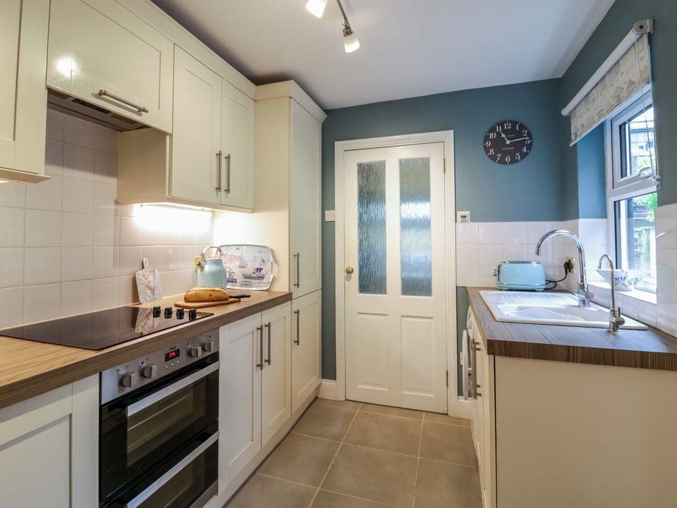 Fridge, electric kettle, toaster, cookware/dishes/utensils