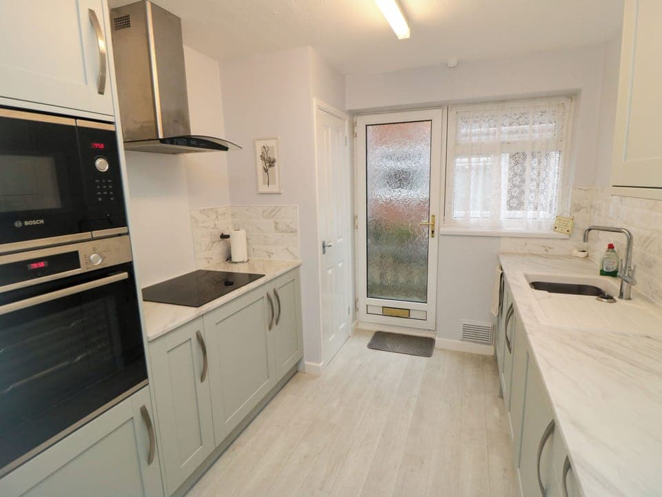 Fridge, dishwasher, electric kettle, cookware/dishes/utensils