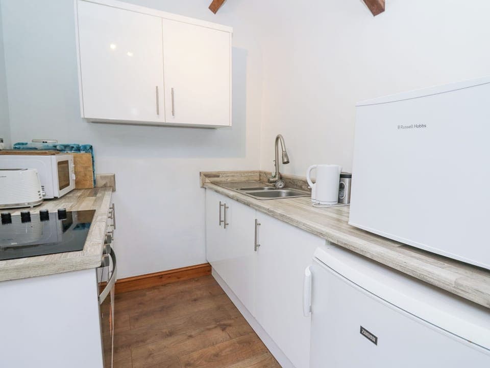 Fridge, electric kettle, toaster, cookware/dishes/utensils