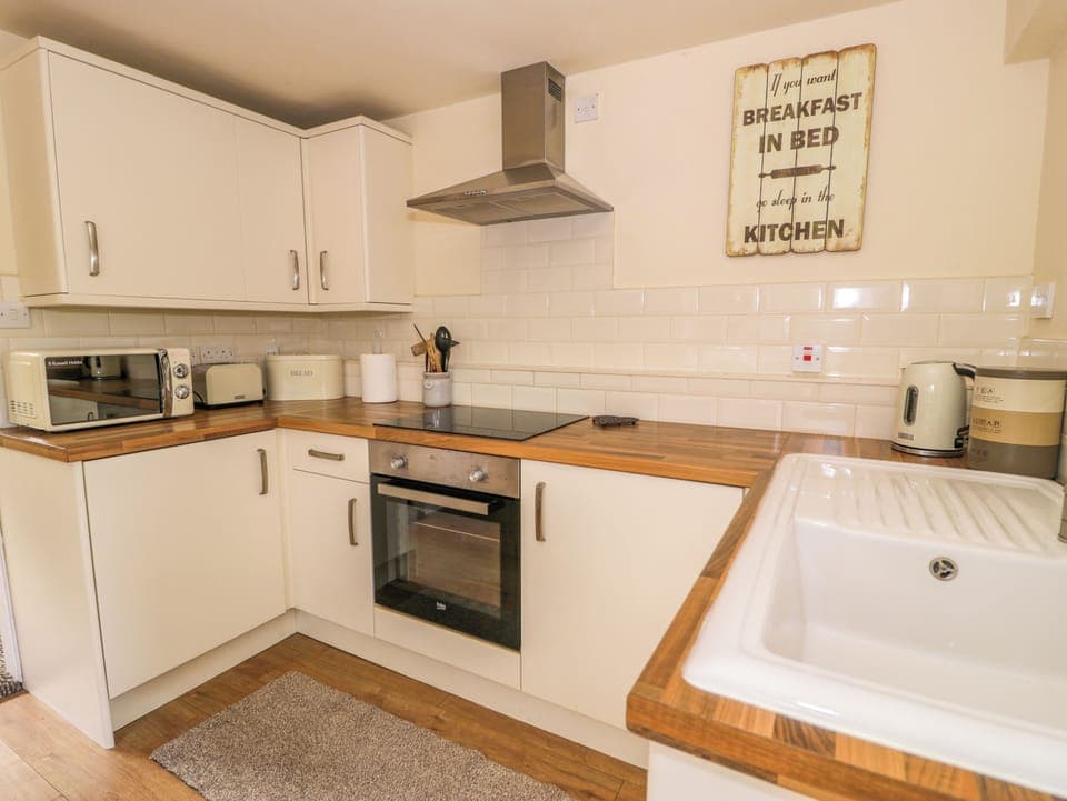 Fridge, electric kettle, toaster, cookware/dishes/utensils