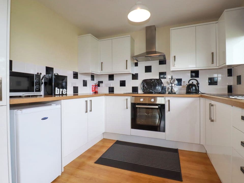 Fridge, electric kettle, toaster, cookware/dishes/utensils