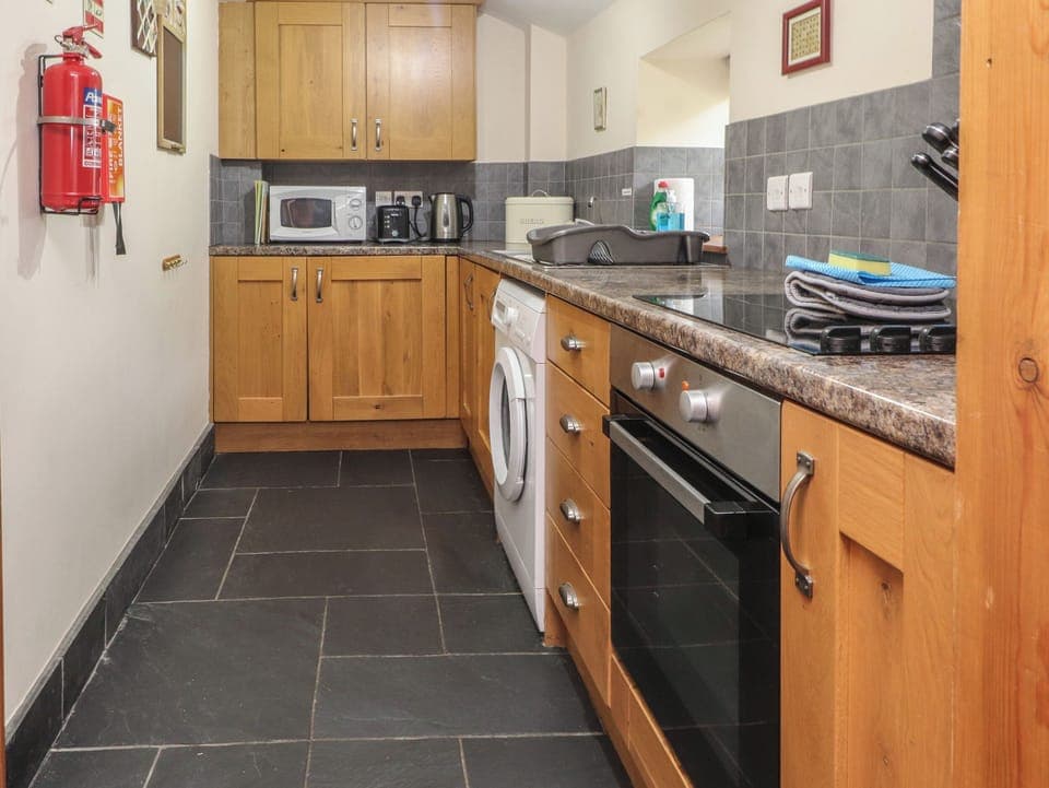 Fridge, electric kettle, cookware/dishes/utensils