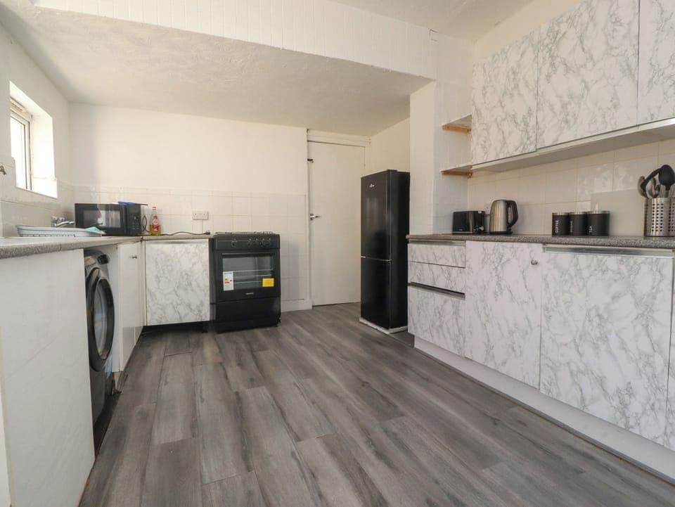 Fridge, electric kettle, toaster, cookware/dishes/utensils