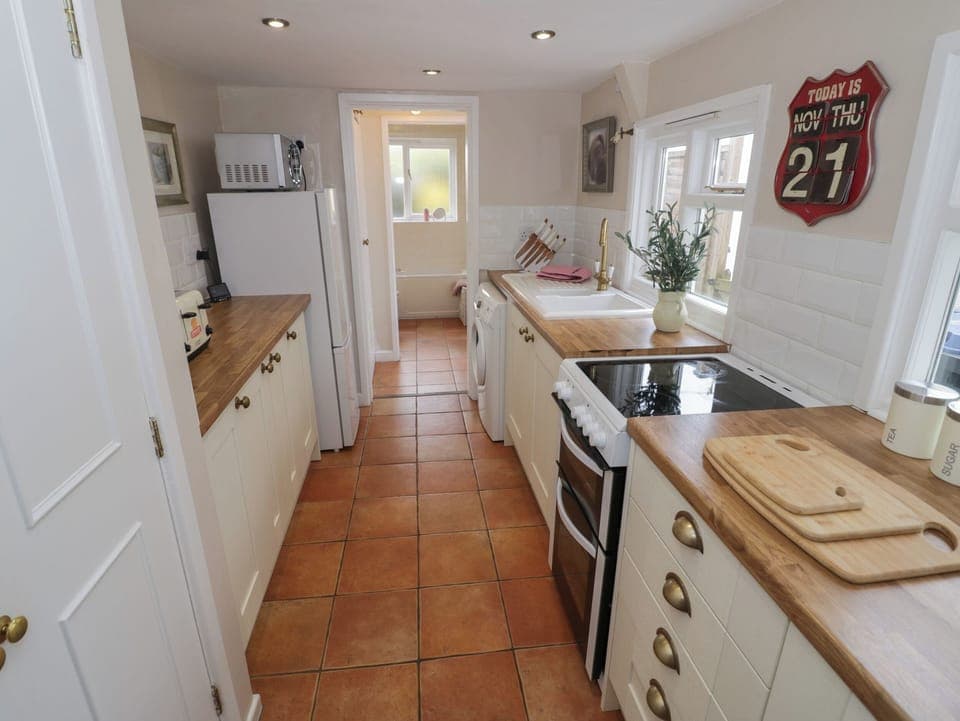 Fridge, electric kettle, toaster, cookware/dishes/utensils