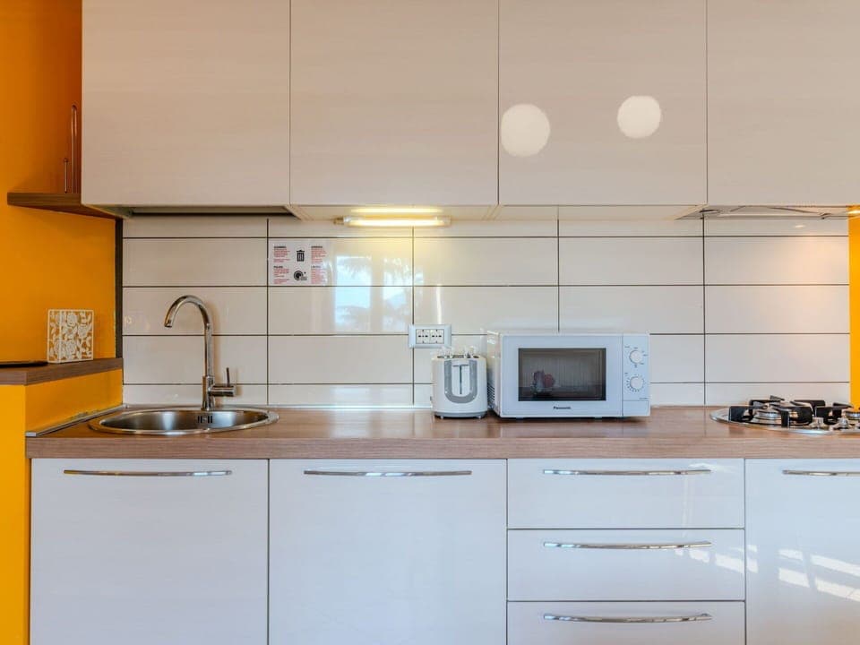 Countertop, Kitchen, Kitchen Appliance, Cabinetry, Major Appliance, Interior Design, Flooring, Wood, Kitchen Sink, Furniture