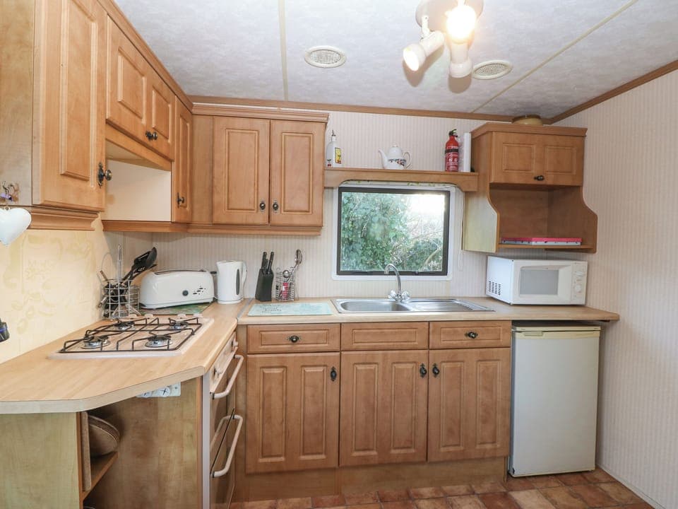 Fridge, electric kettle, toaster, cookware/dishes/utensils