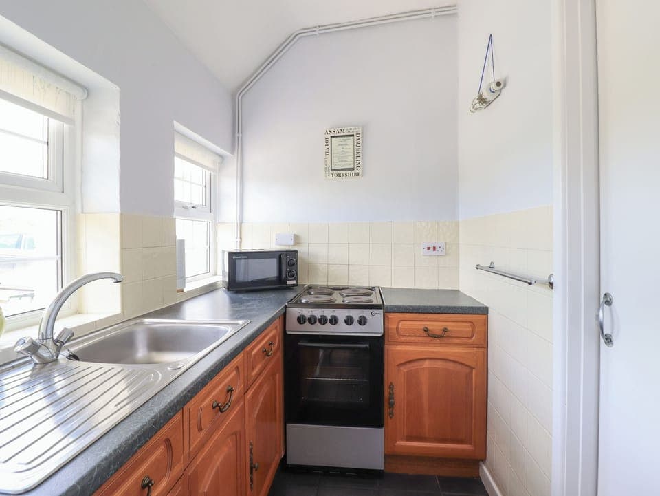 Fridge, electric kettle, toaster, cookware/dishes/utensils