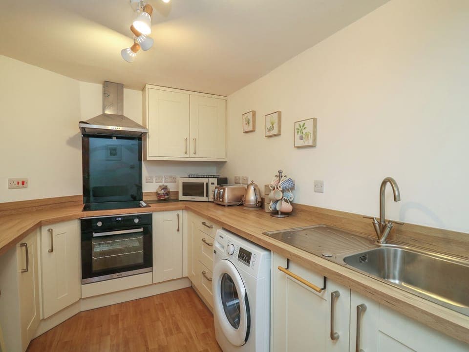 Fridge, electric kettle, toaster, cookware/dishes/utensils