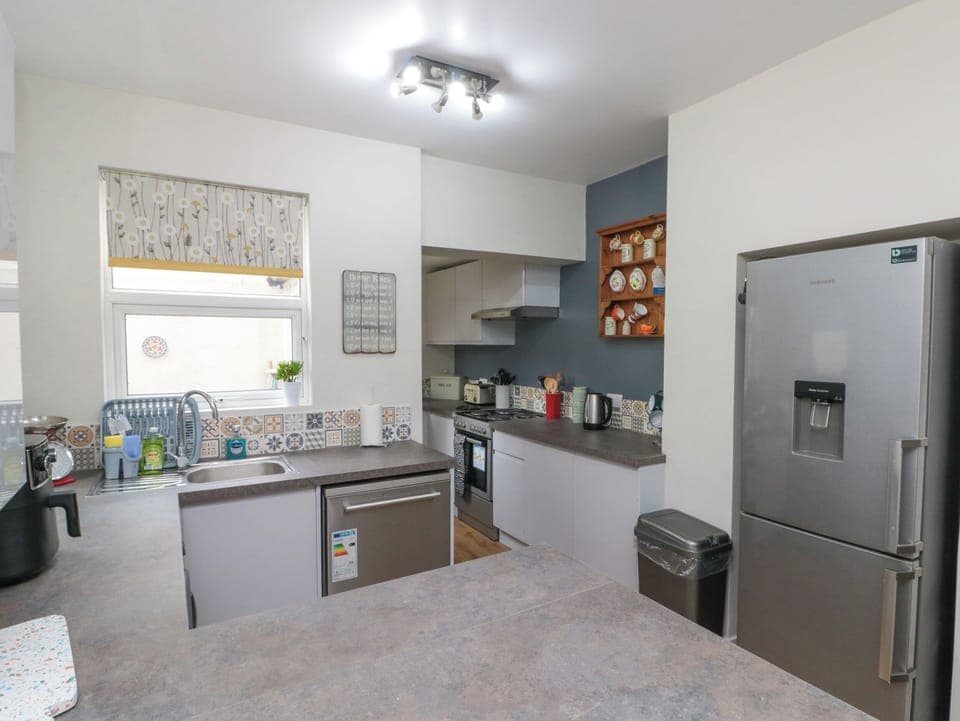 Fridge, dishwasher, electric kettle, cookware/dishes/utensils