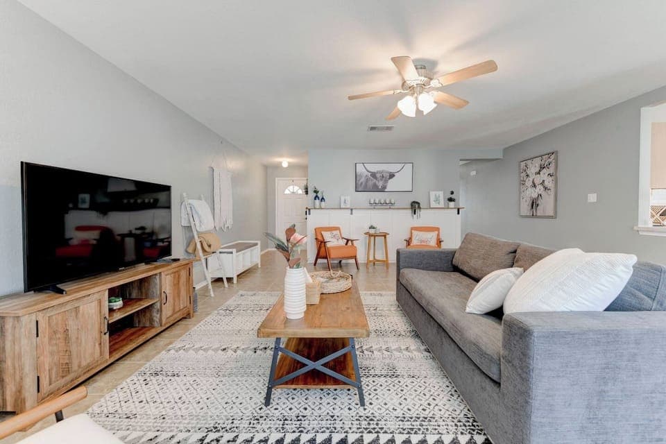 Kickback and watch your favorite shows on our 55" Roku TV