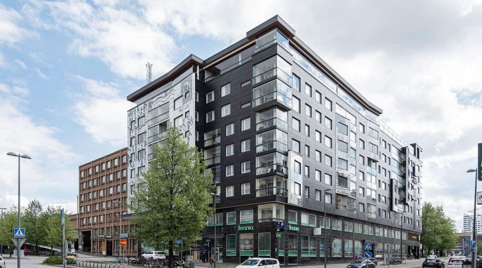 Property building. The apartment is located right next to Tampere Railway station.