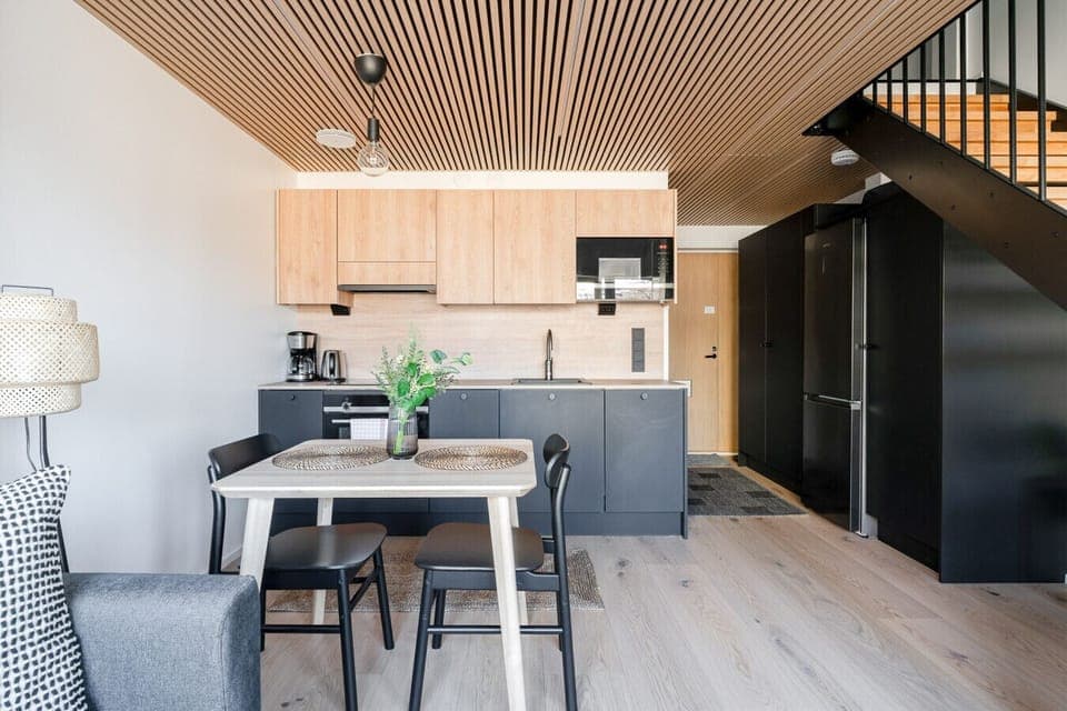Apartment kitchen with a dishwasher, oven, stovetop and a microwave