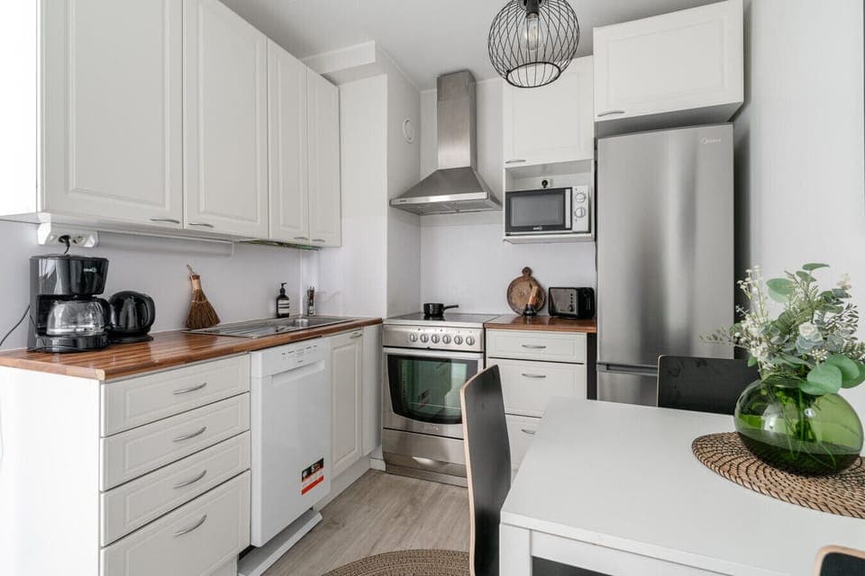 Cook complete meals in our fully equipped kitchen, which includes a full-sized stove, oven, and microwave. The modern fridge-freezer has plenty of room for all your groceries.