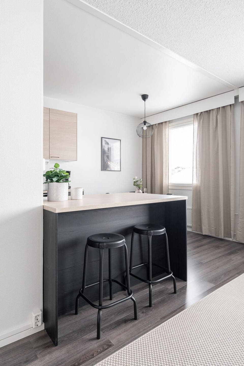 The stylish breakfast bar provides a casual spot for your morning coffee or a dedicated workspace if you need to catch up on emails.