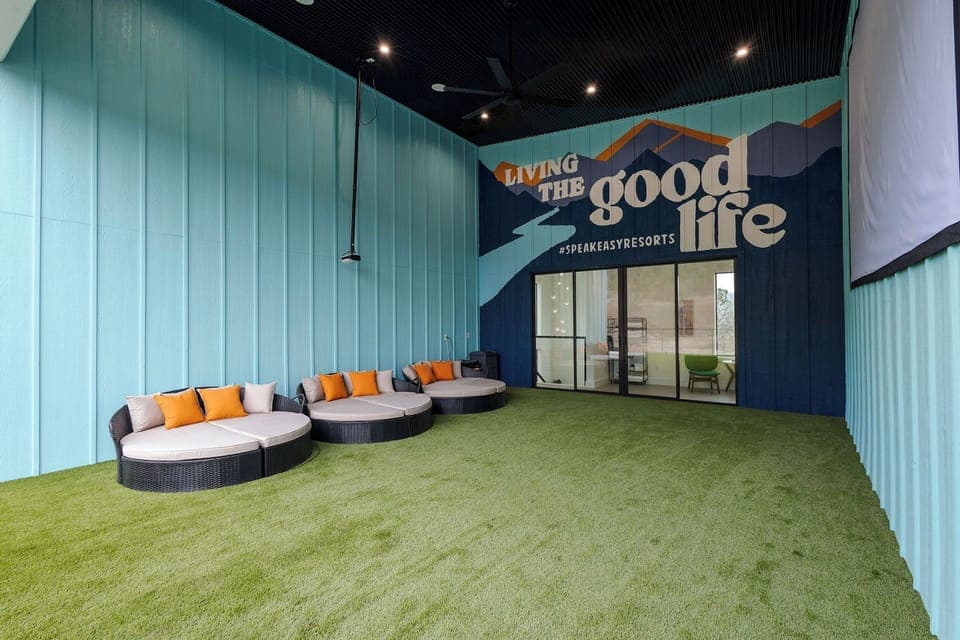 Kick off your shoes and get cozy in our outdoor movie room with 200" movie screen.