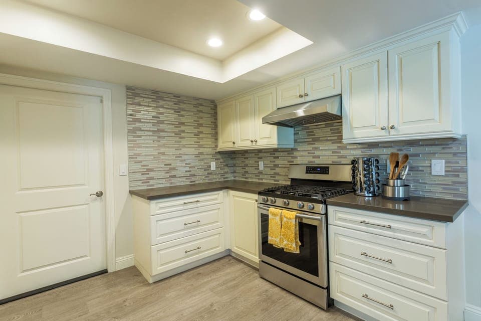 Fully stocked kitchen with gas stove and oven. 