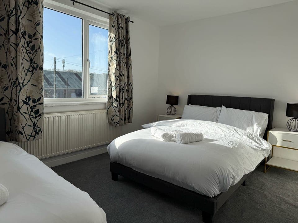 Spacious bedrooms with two double bed and each with a comfy bed. Perfect for families or friends, offering a peaceful retreat with soft linens and cozy decor. Ideal for a restful night’s sleep after a day of exploring or work.