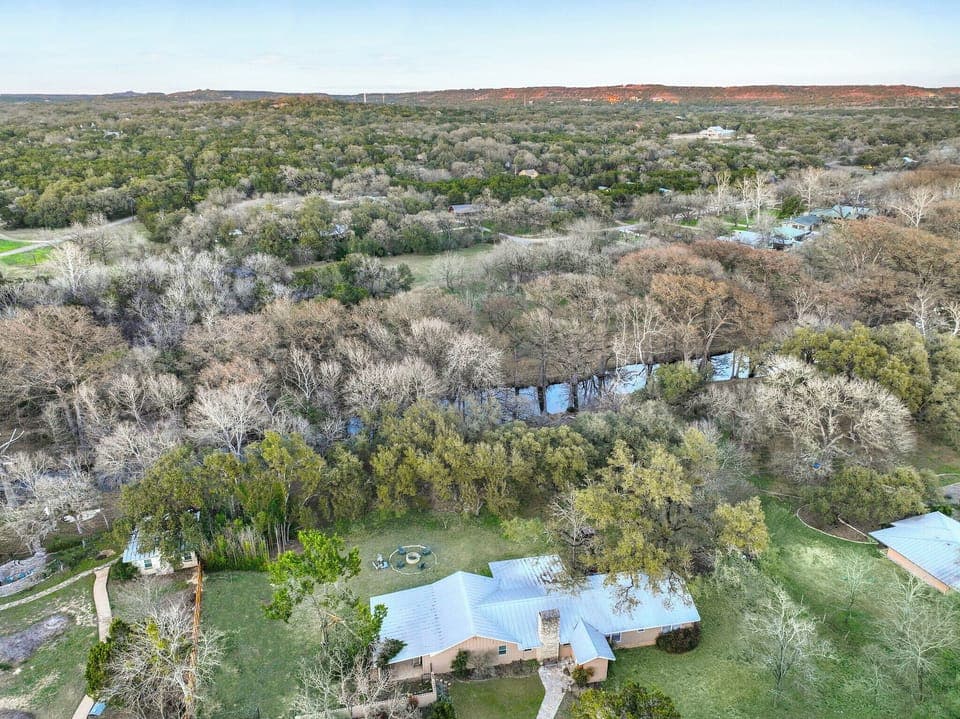 Aerial view of the home in proximity to the water