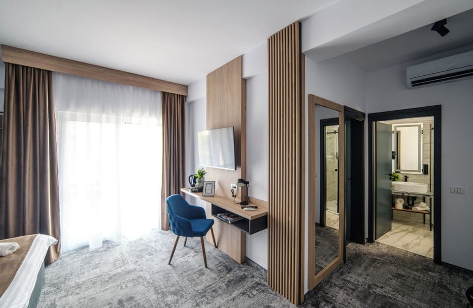 Executive Quadruple Room | In-room safe, blackout drapes, iron/ironing board, free WiFi