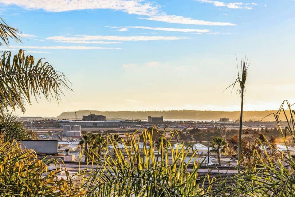 Wake up to stunning panoramic views of the city and distant mountains framed by lush palm trees. Enjoy breathtaking sunsets and a peaceful tropical vibe from your private retreat. The perfect escape for relaxation and inspiration!