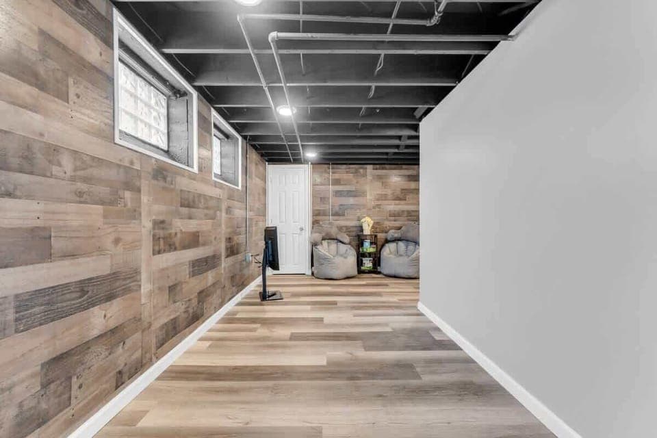 Cozy vibes in this basement retreat!  Perfect for movie nights and chill sessions.  #basementgoals