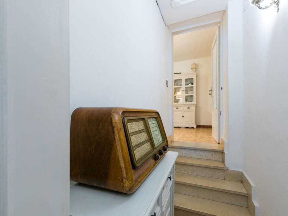 Furniture, Wood, Interior Design, Flooring, Kitchen, Cabinetry, Floor, Room, Major Appliance, Cupboard